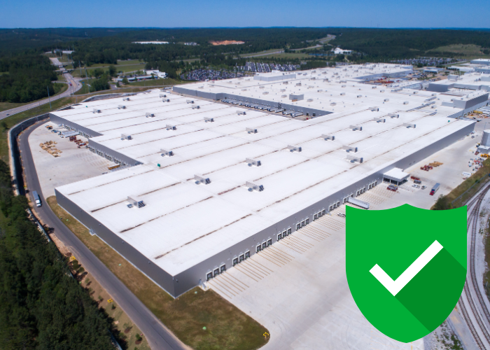 a commercial building with its roofing system complete with guaranteed quality