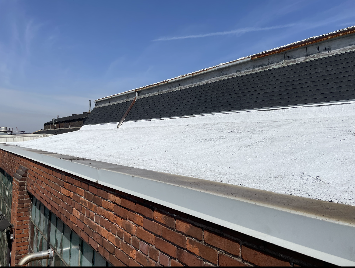 Kemp Coating's applying a coating to a commercial Roof