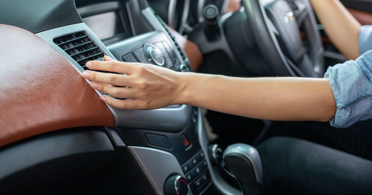 Image of Hand testing aircon temperature