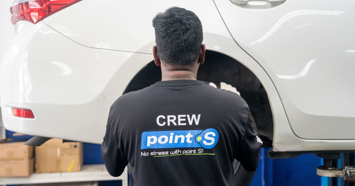 Image of Mechanic at BCC Automotive inspecting tyres