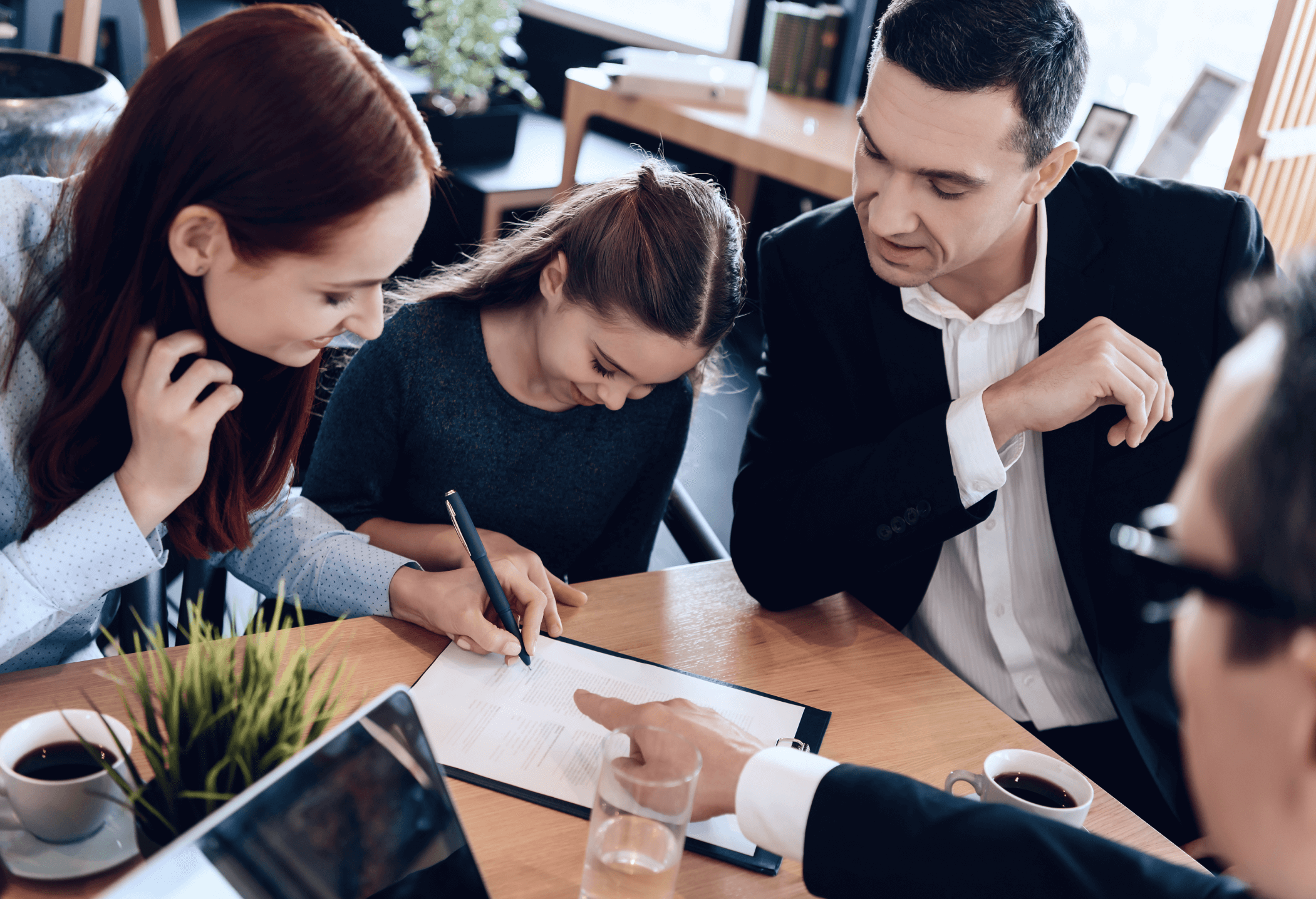 Family signing paperwork with Laywer or Attorney
