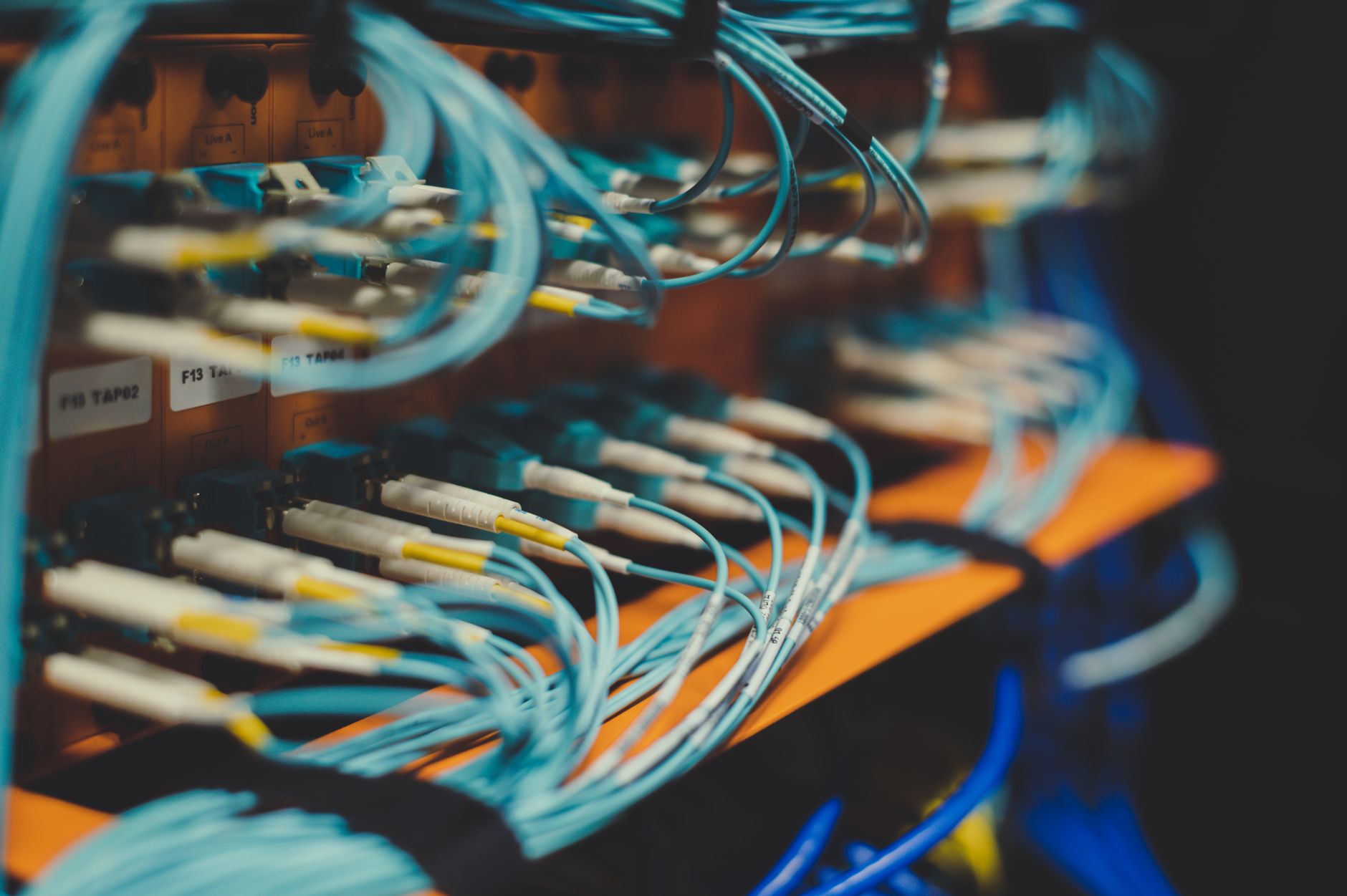 Enterprise network rack and cables representing Cisco SD-WAN infrastructure vulnerability