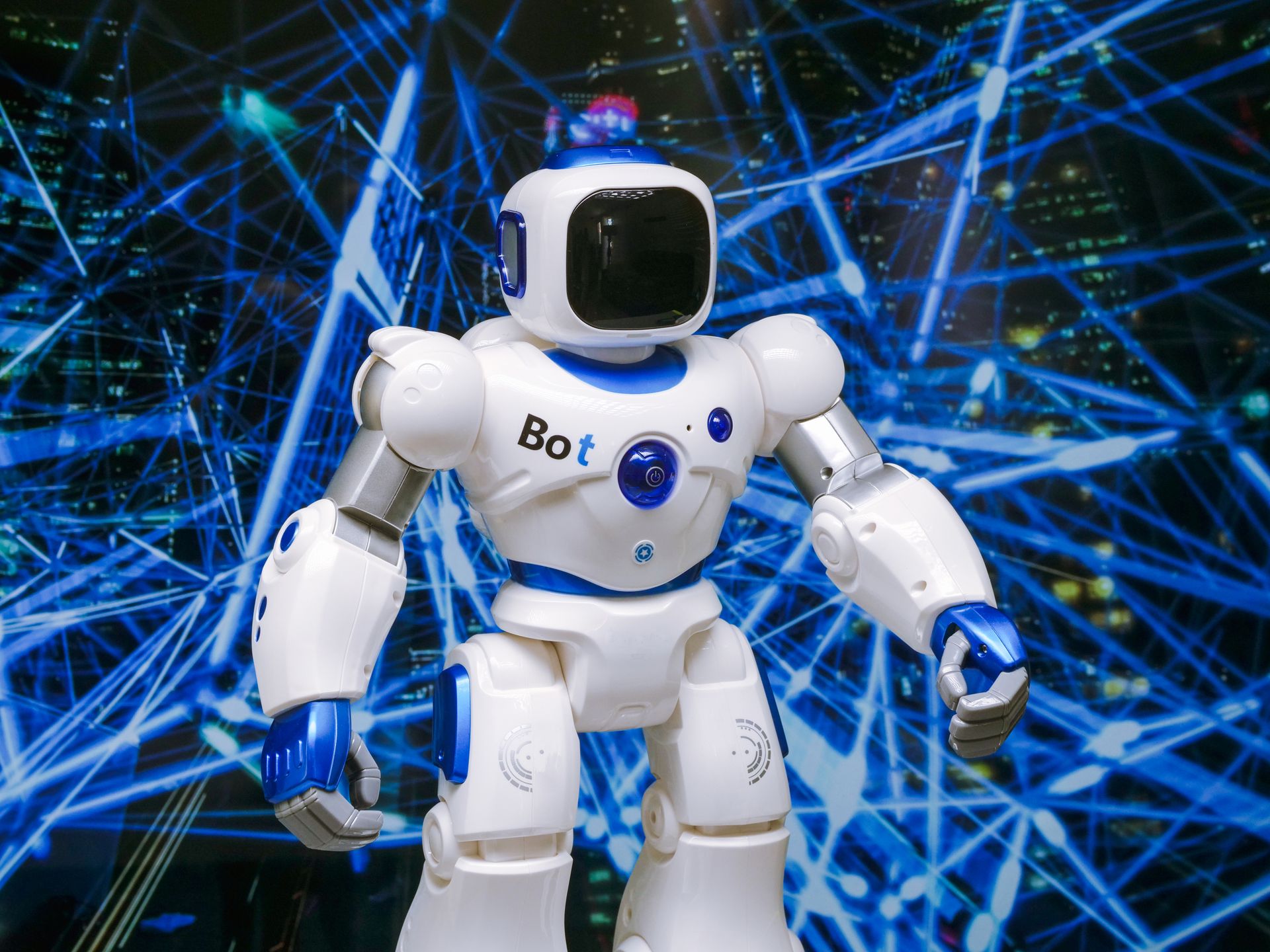 Advanced humanoid robot with glowing blue accents in a dark digital environment, representing AI agent security risks