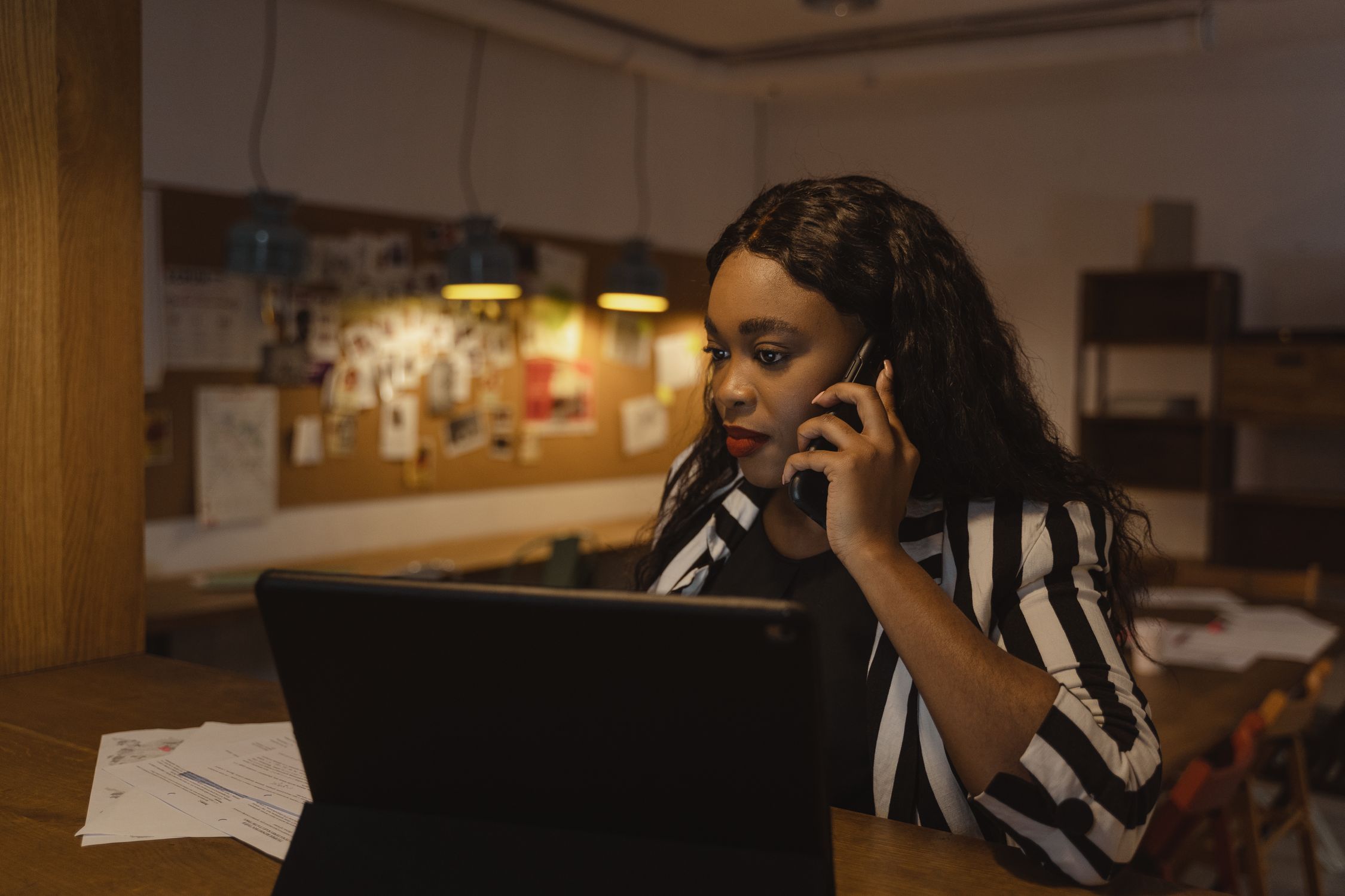 Professional person on a video call looking concerned at a laptop representing voice fraud