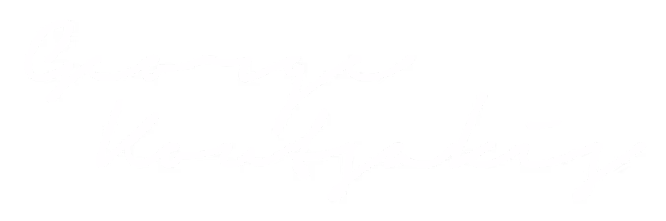 White handwritten signature reading 'George Koumoutsakis' on a transparent background.