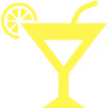Yellow cocktail glass with a lemon slice and straw.
