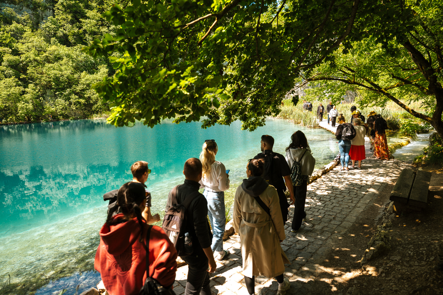 Tourists exploring the natural beauty of the Plitvice Lakes National Park