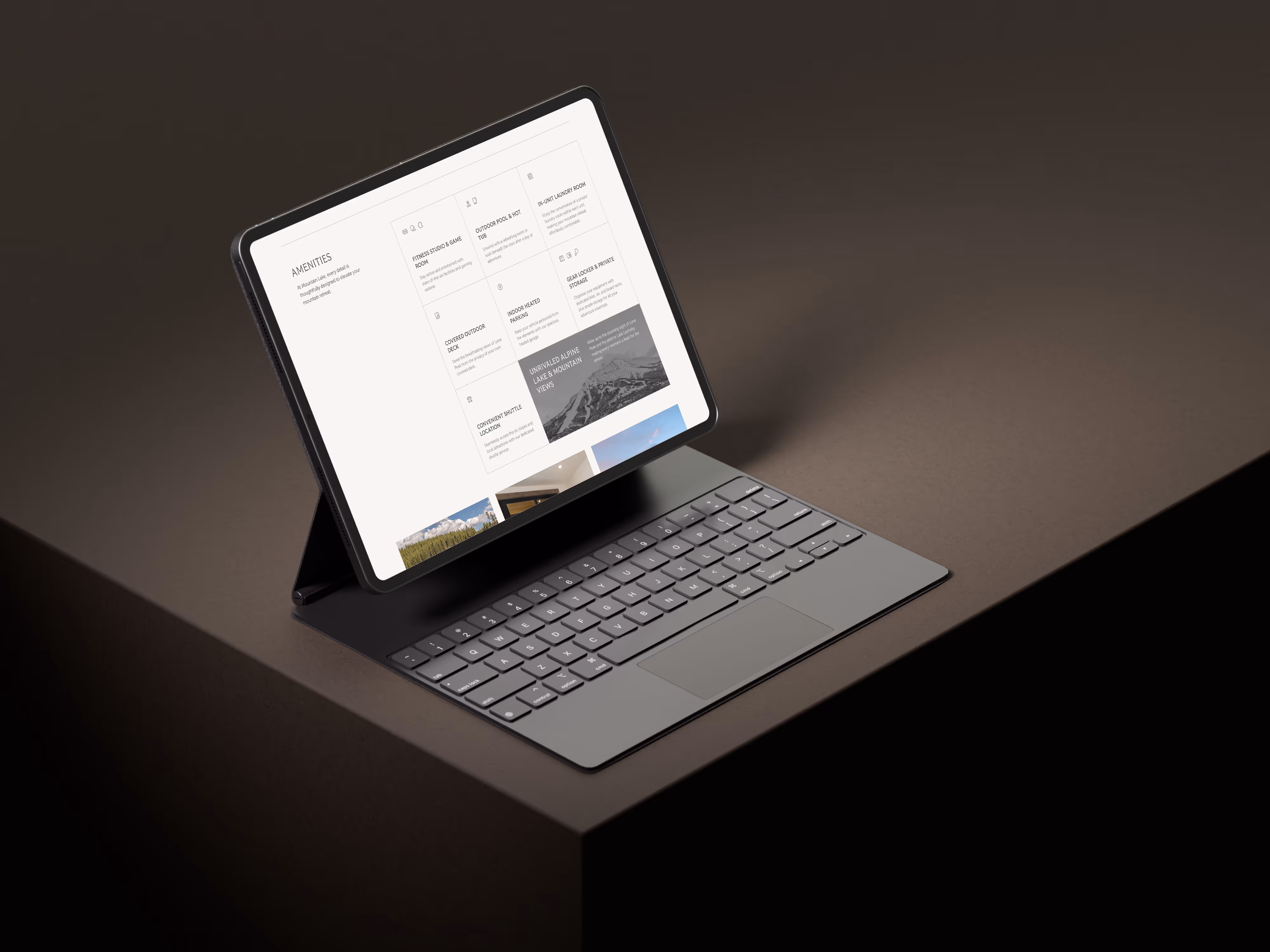 Tablet with a detachable keyboard displaying a webpage about amenities, placed on a brown surface.