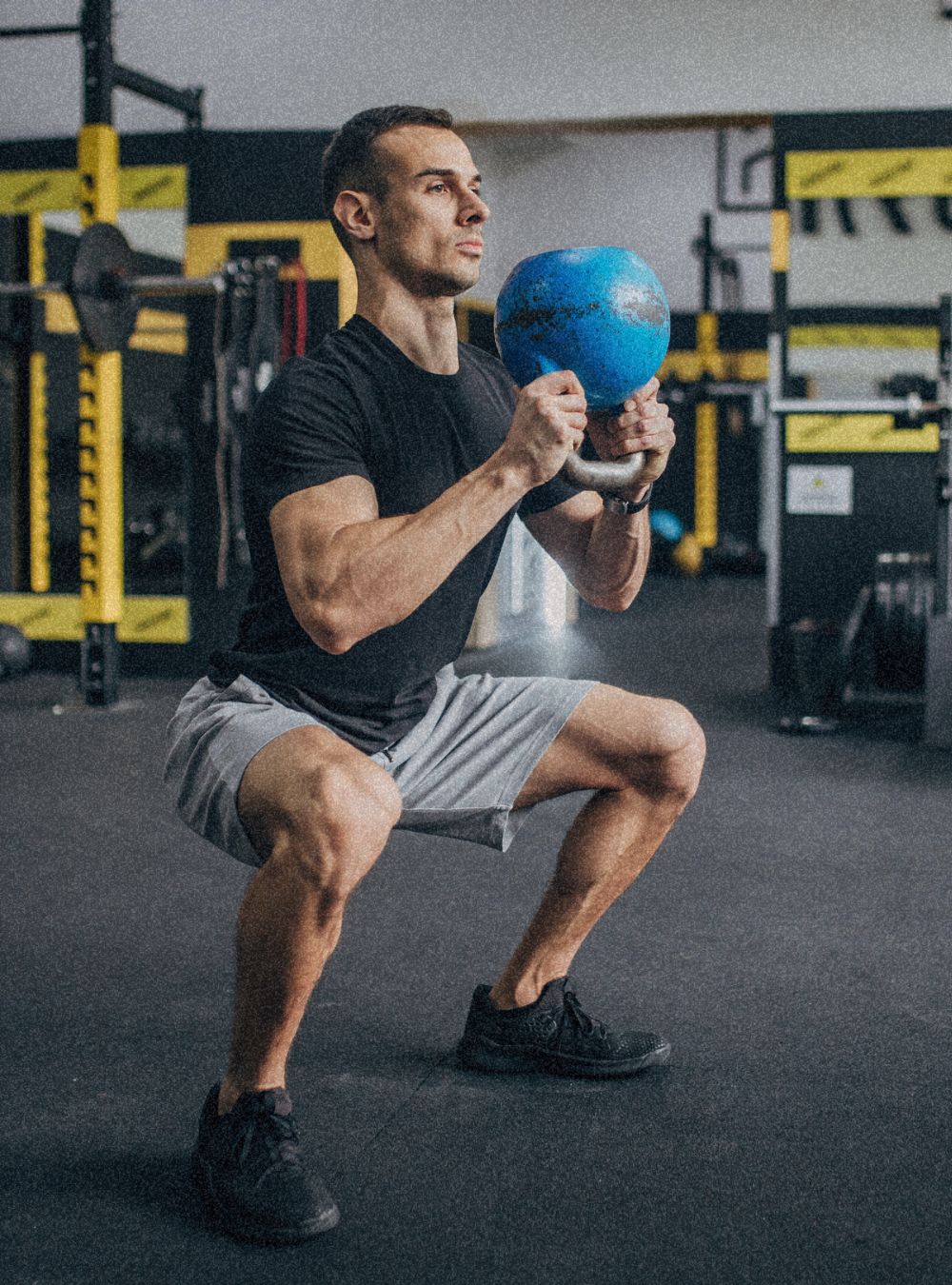 men doing functional training with kettlebell