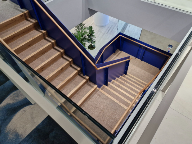Carpeted stairs with steel balustrades