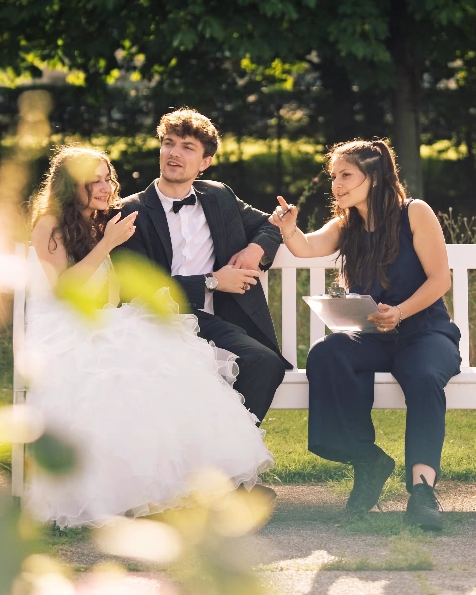 a bride and a groom sit next to Tamara Lazic, she is a wedding Planner
