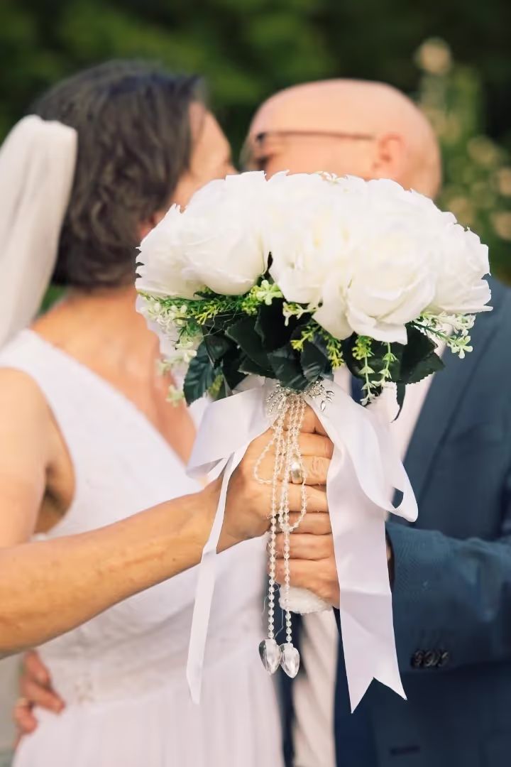 bride and groom kissing behing flowers, Bogdan Lazic photography