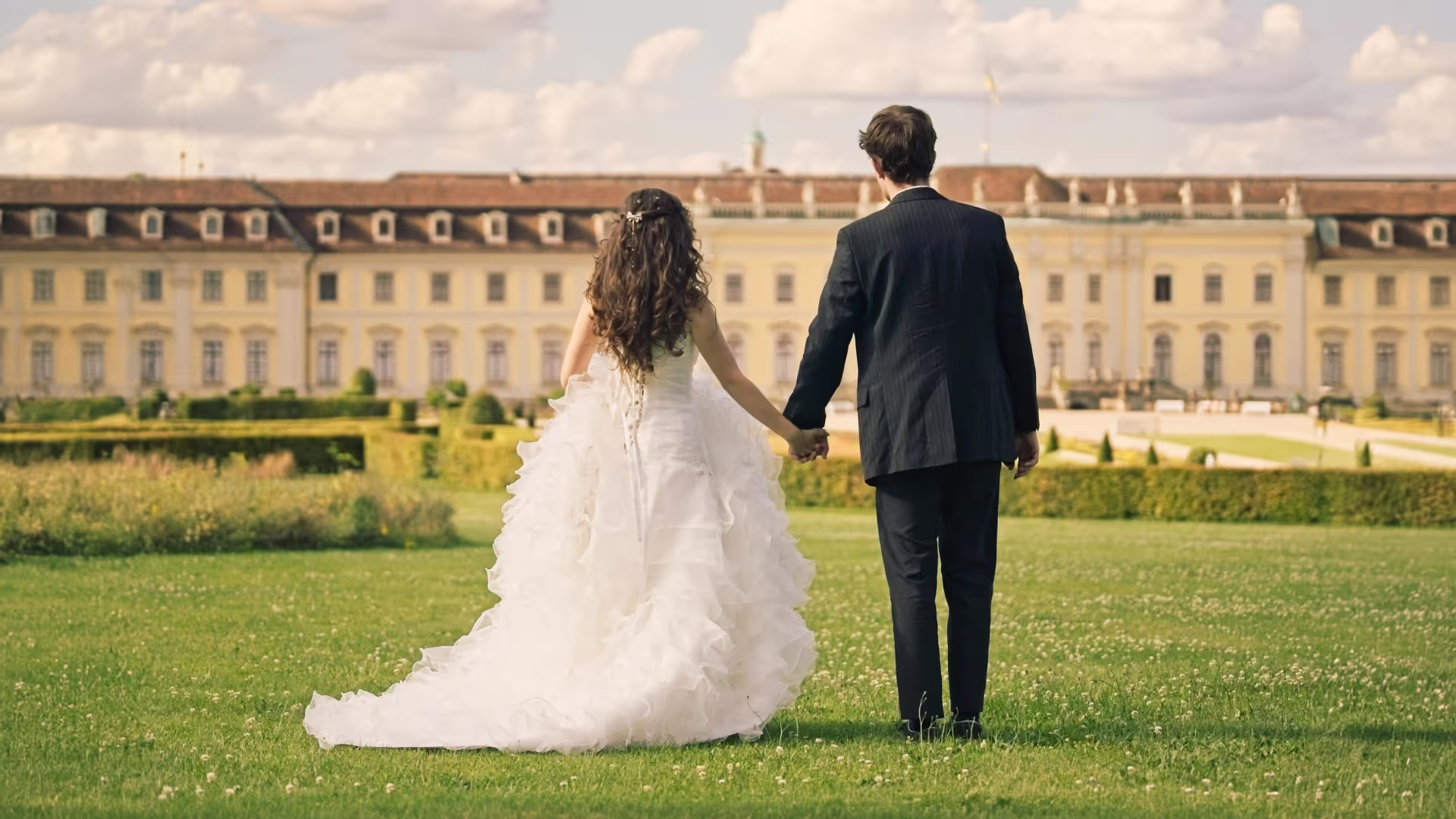 bride and grwoom with huge castle in background at a wedding, timefor2