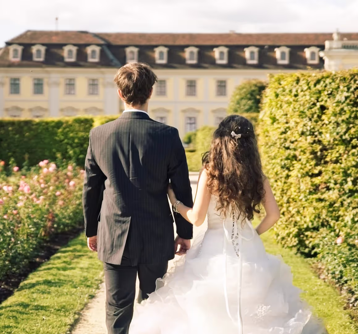bride and groom with castle in background