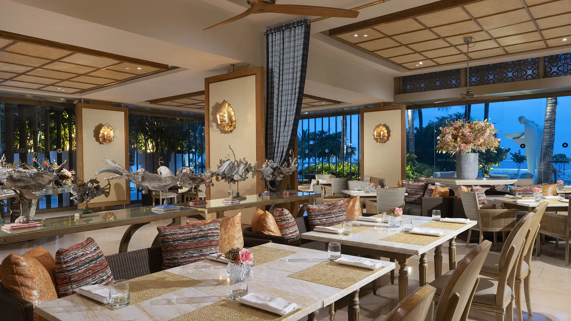 Soleil beachfront restaurant at Mulia Bali with ocean views and open dining space