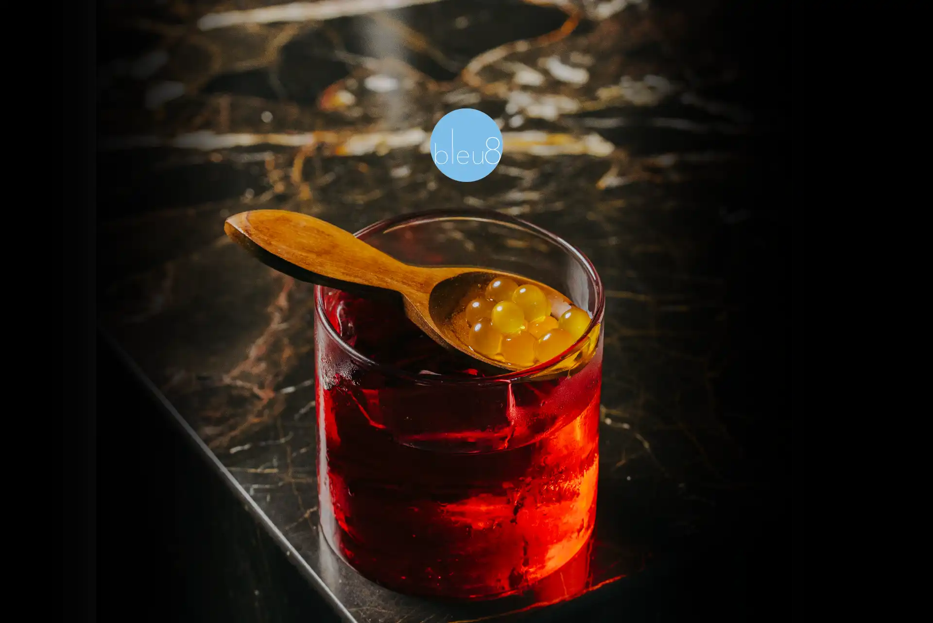 Artisan cocktails at bleu8 – rotating selection including The Shape, Violette, and The King & Cave