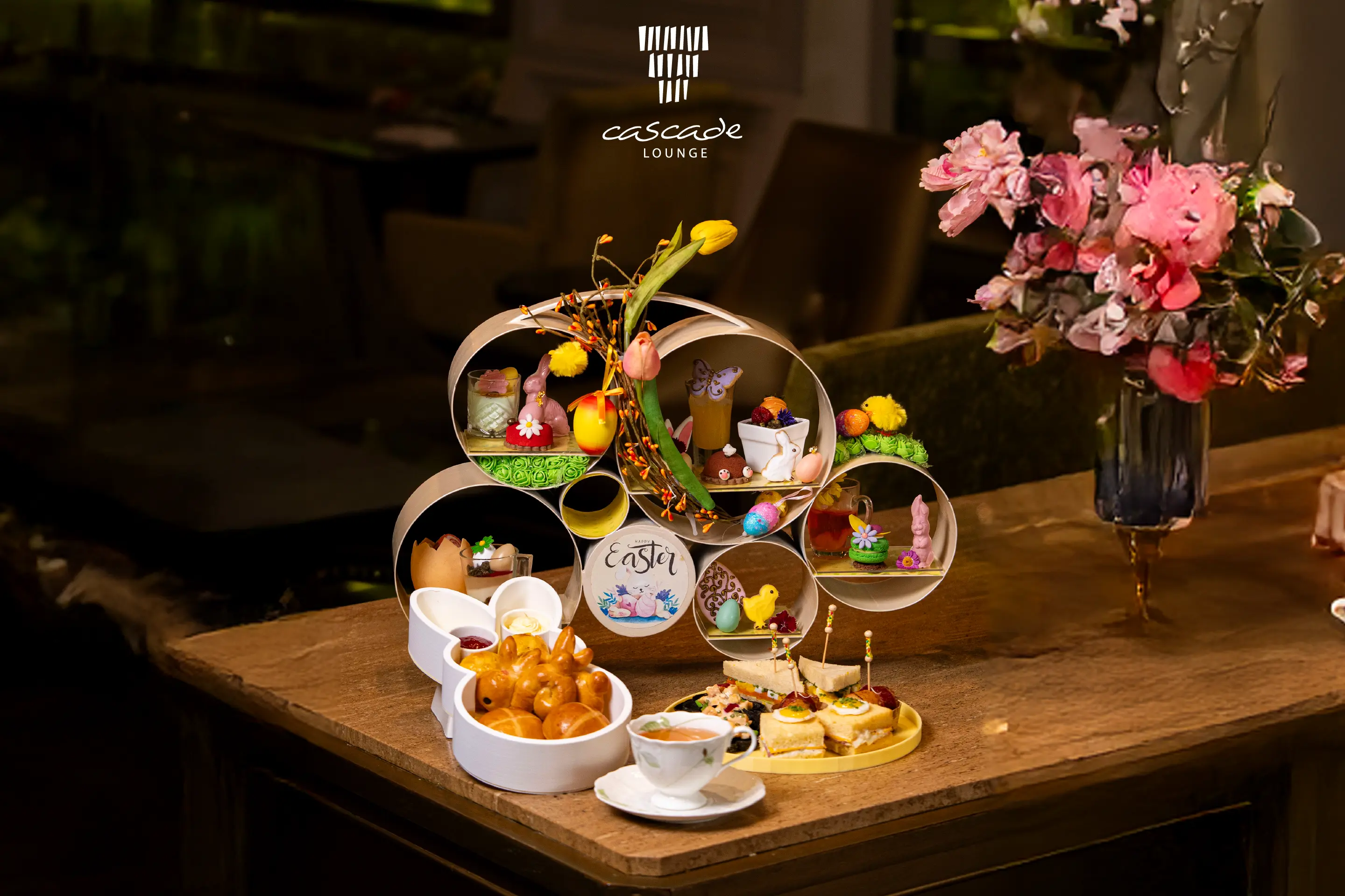  Charming Easter afternoon tea, featuring a selection of seasonal pastries, sweet treats, and savoury bites
