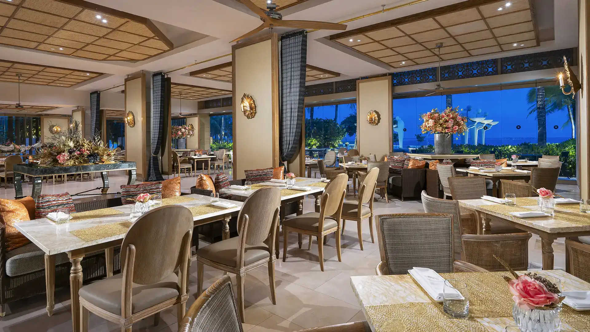 Soleil beachfront restaurant at Mulia Bali with ocean views and open dining space