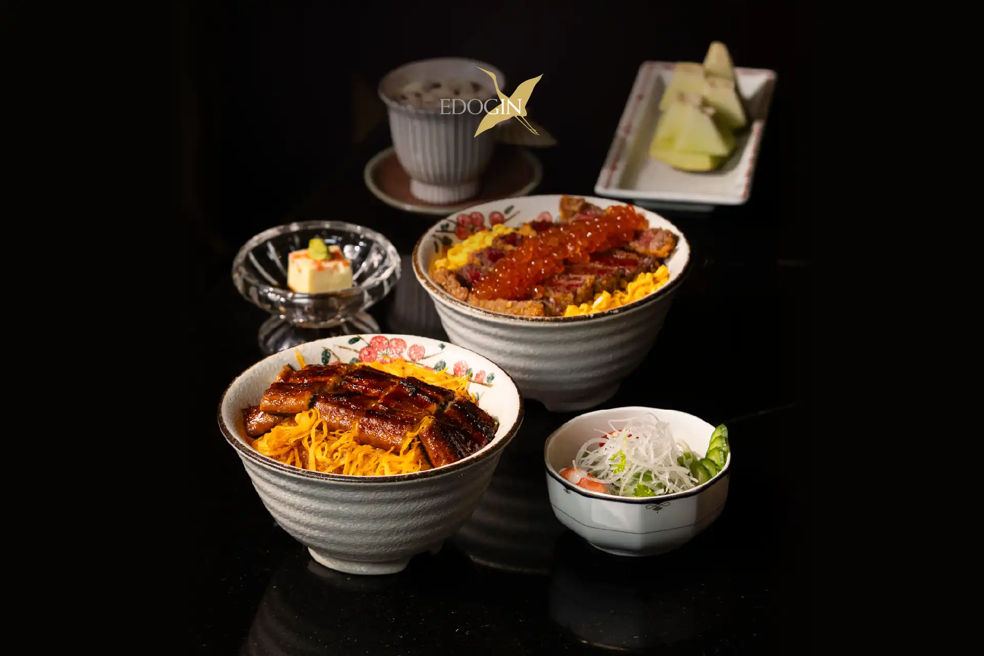 Assorted Japanese donburi rice bowls featuring premium meats and seafood served over warm Japanese rice.