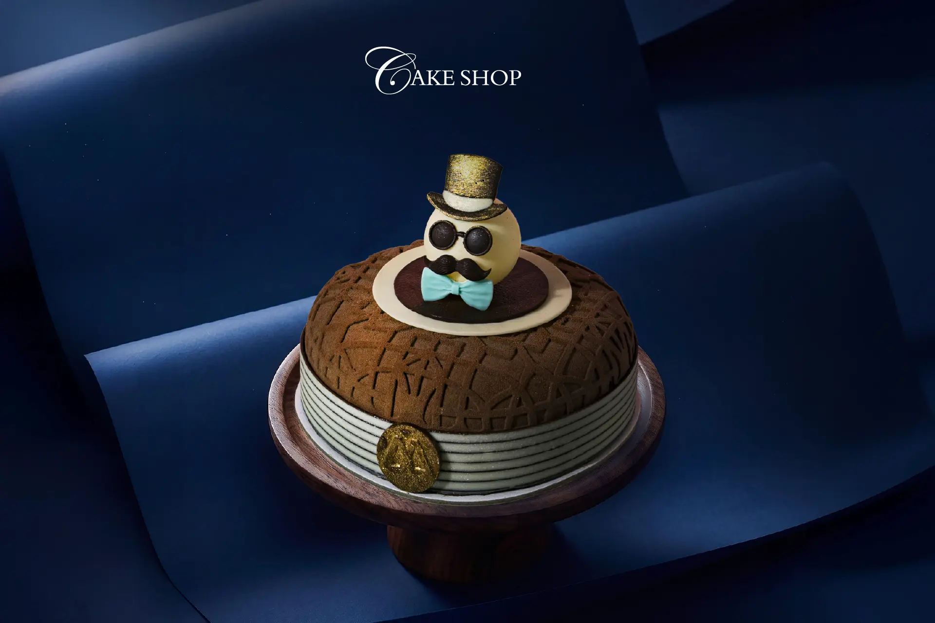 Father’s Day signature cake from Cake Shop at Hotel Mulia Senayan, featuring an elegant chocolate design and decorative topper celebrating fathers.