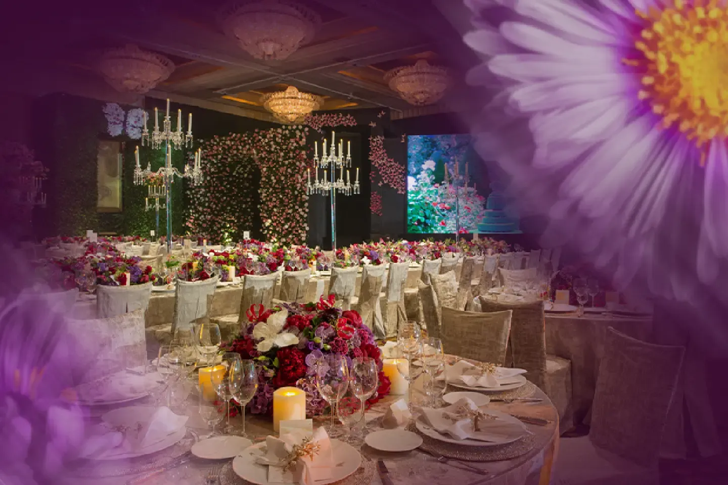Elegant ballroom setup at Hotel Mulia Senayan featuring floral arrangements, banquet tables, and chandeliers as part of The Aster Package event promotion.