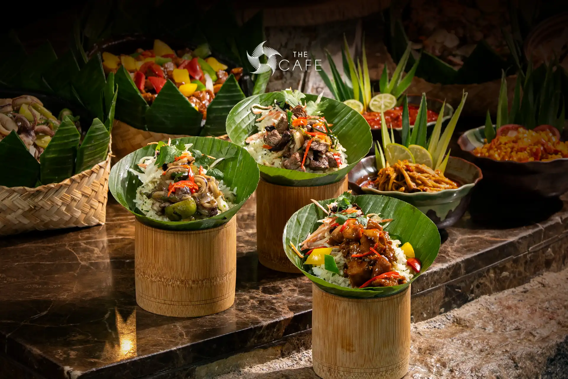 Bamboo Rice at The Cafe featuring fragrant rice infused with aromatic herbs and served with traditional Indonesian side dishes.