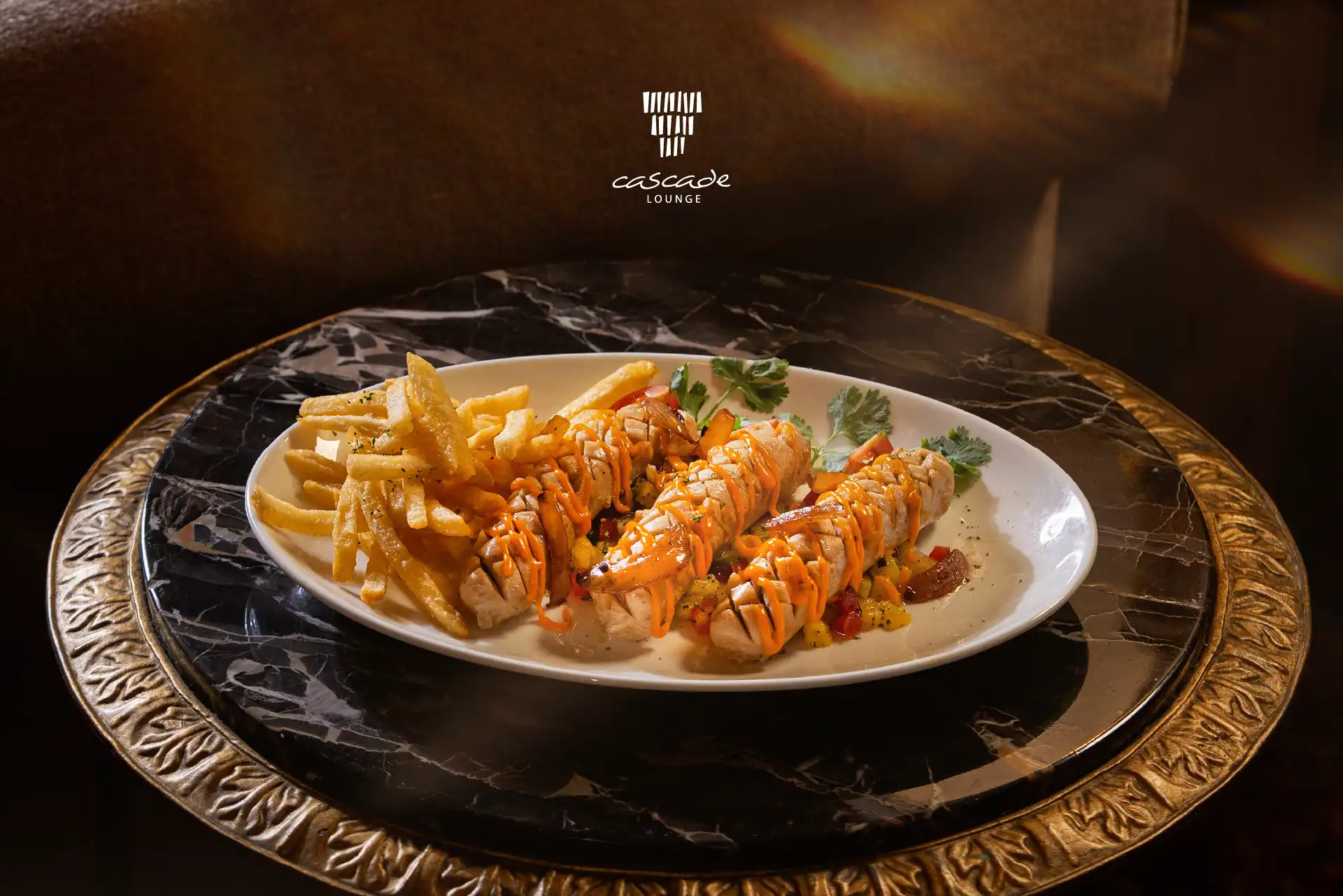 Sausage Platter at Cascade Lounge featuring premium sausages, crispy fries, and classic accompaniments in an elegant lounge setting.