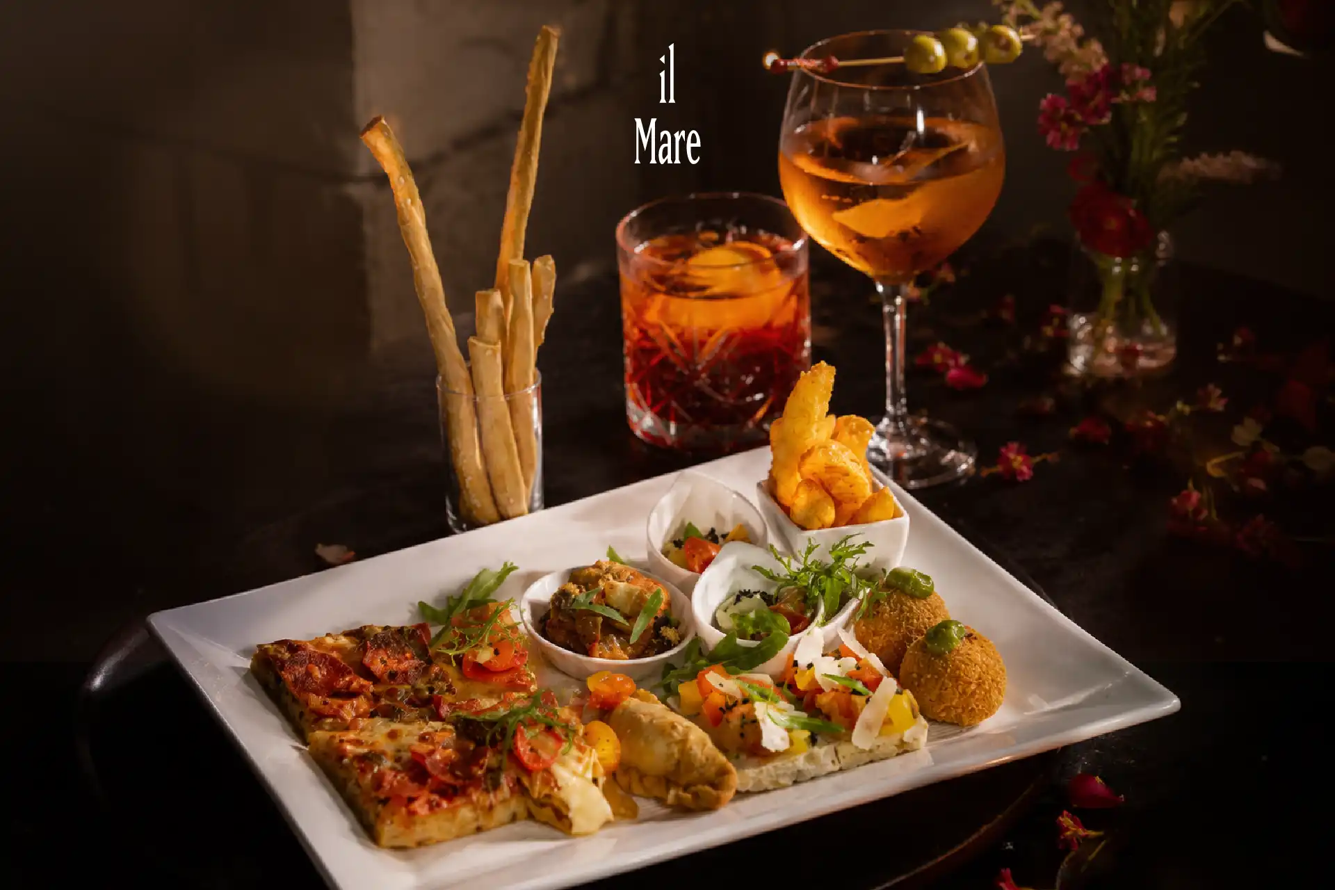 Amore Aperitivo at il Mare featuring Italian canapés paired with selected cocktails and beverages in an elegant dining setting.