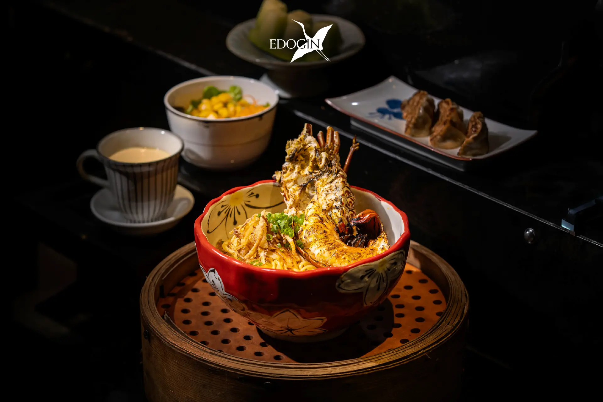 A premium bowl of authentic Japanese ramen with grilled lobster, rich broth, and signature side dishes served at Edogin, Hotel Mulia Senayan, Jakarta.