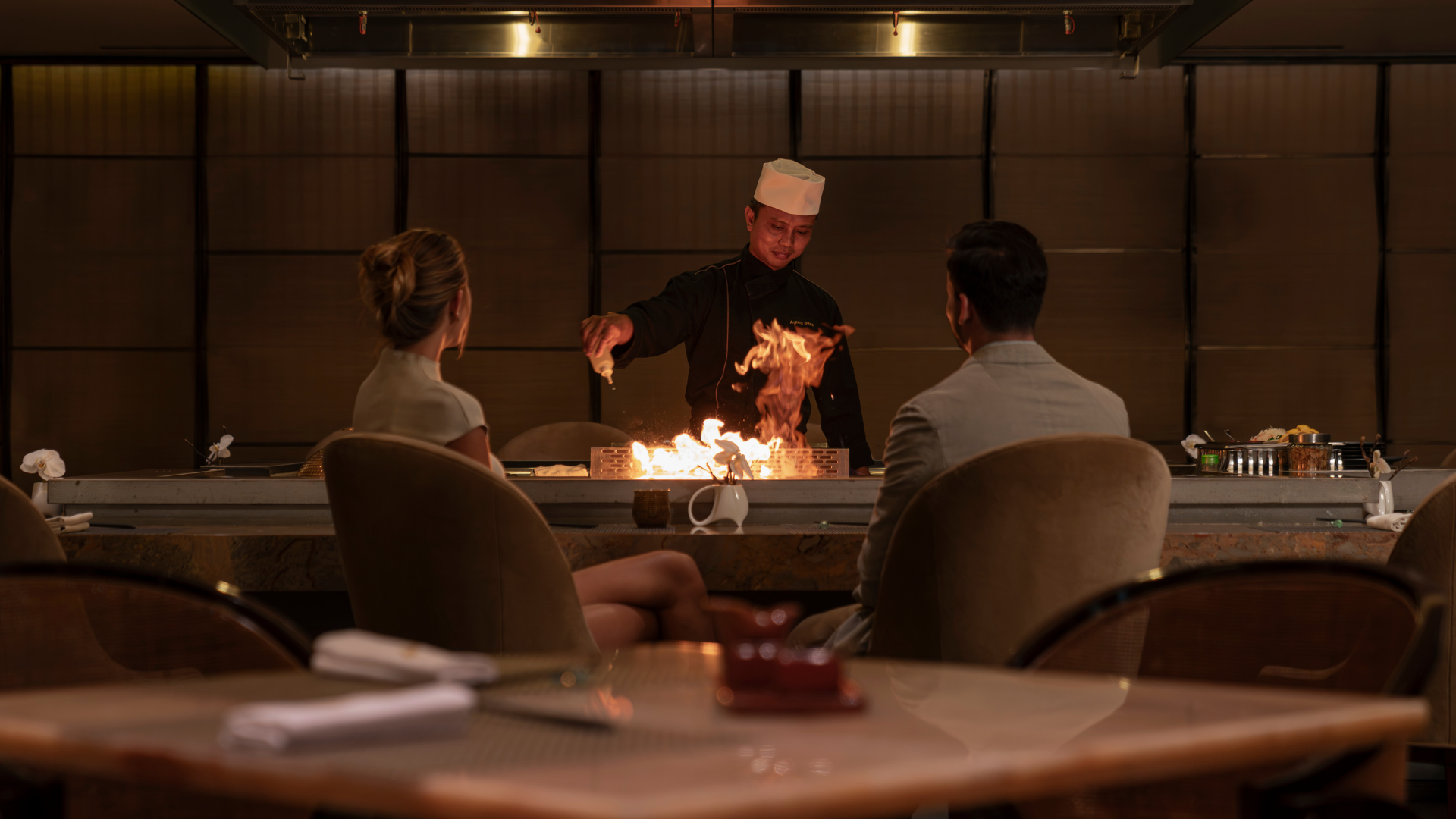 Guests exploring the international buffet stations at The Cafe, Mulia Bali