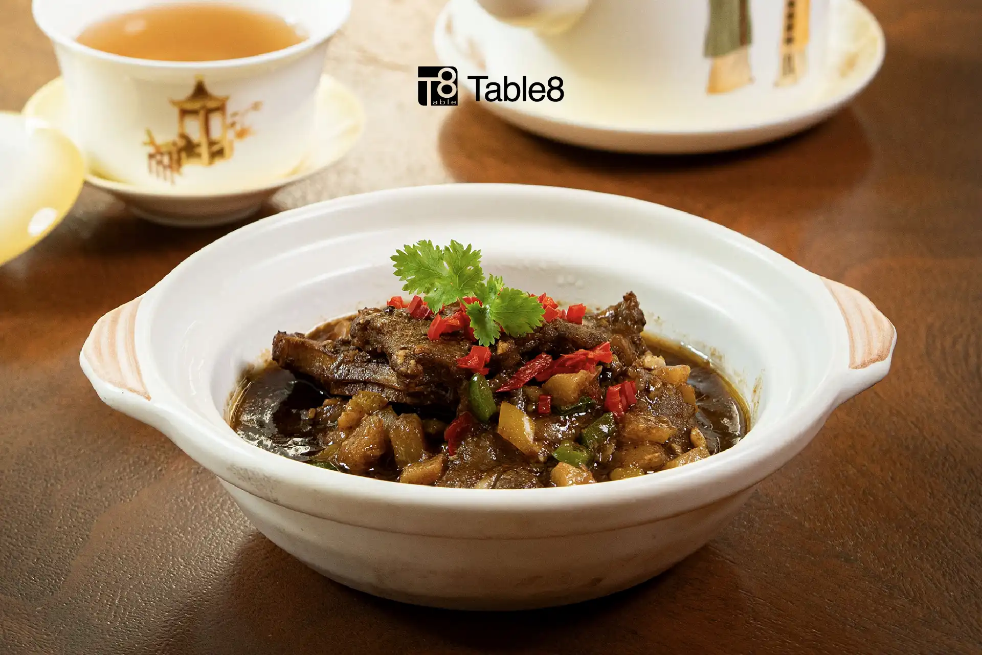 Traditional claypot dish with braised meat and vegetables, part of The Art of Claypot promotion at Table8, Hotel Mulia Senayan.