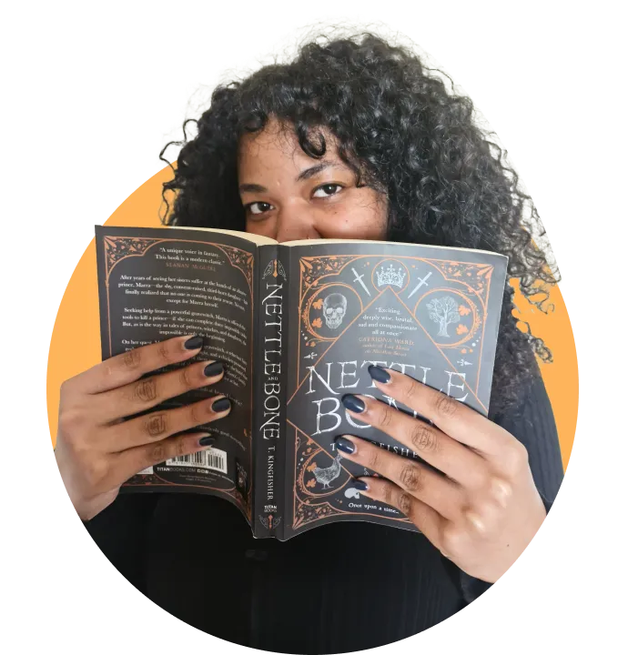 Woman holding black book