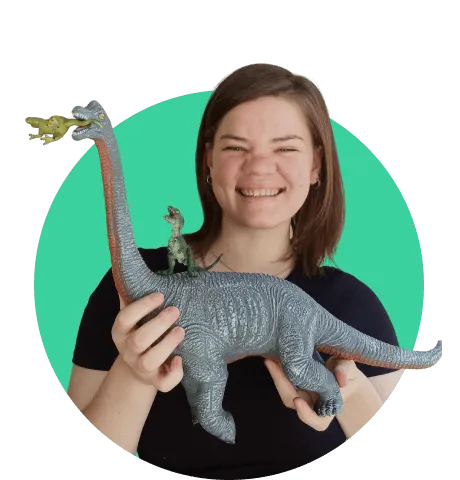 Woman with toy in hand smiling