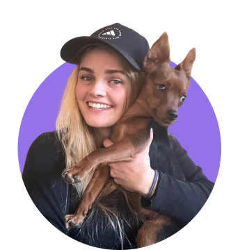 Woman holding a little dog