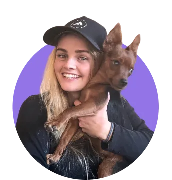 Woman holding a little dog