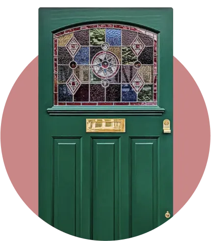 A traditional victorian front door with stained glass