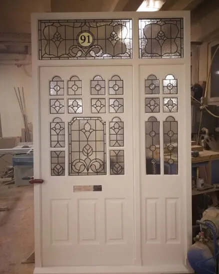 victorian style period front door with stained glass