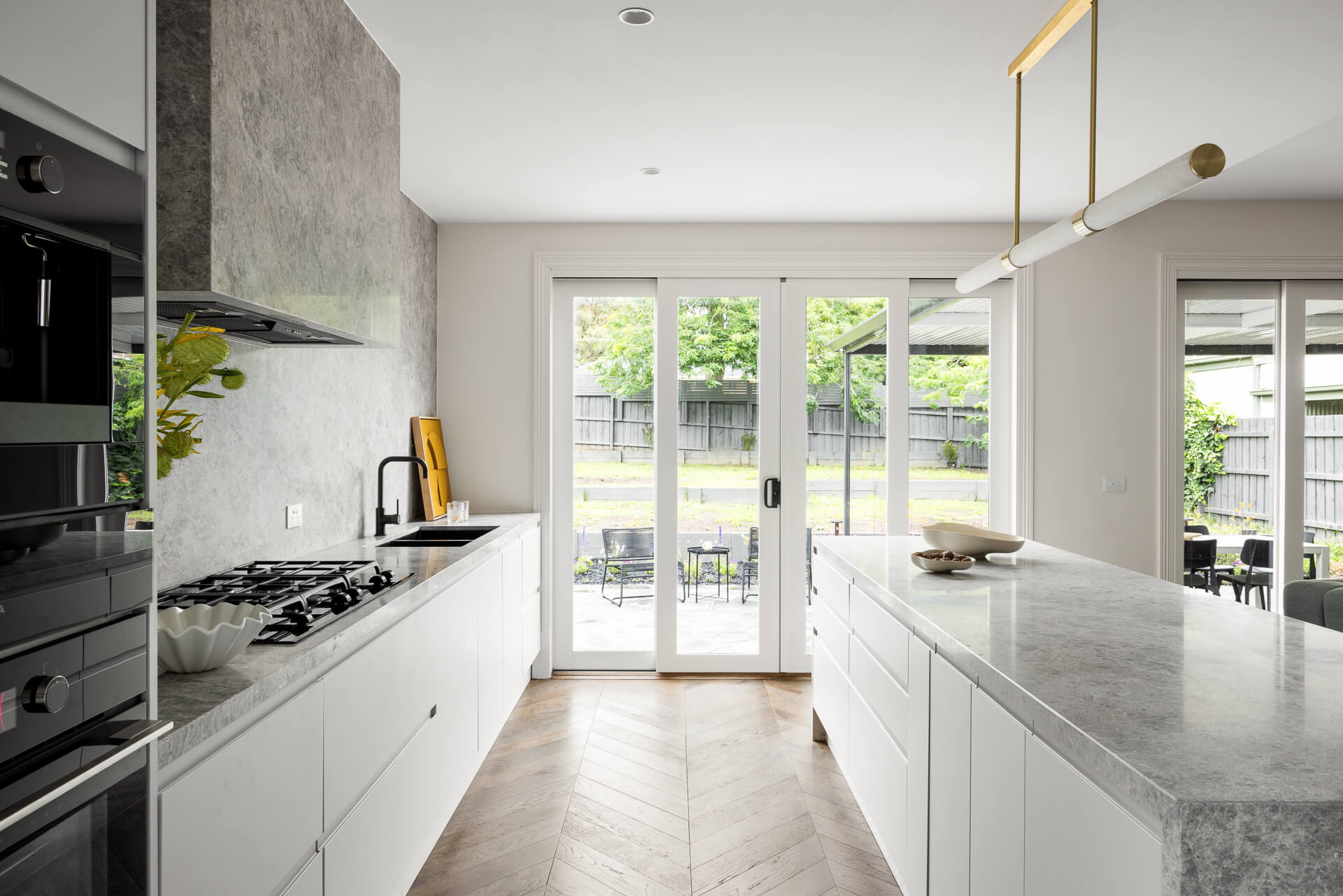 The Belmont House by Randco Design Studio featuring the UM1170-9BS Silent Black Undermount Rangehood