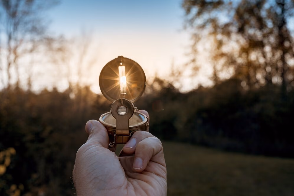 and holding a compass symbolizing direction, planning, and navigation
