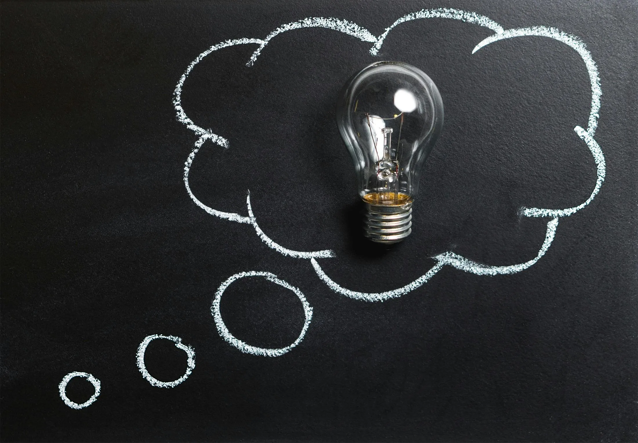 Blackboard featuring a cloud illustration and business growth concept drawing