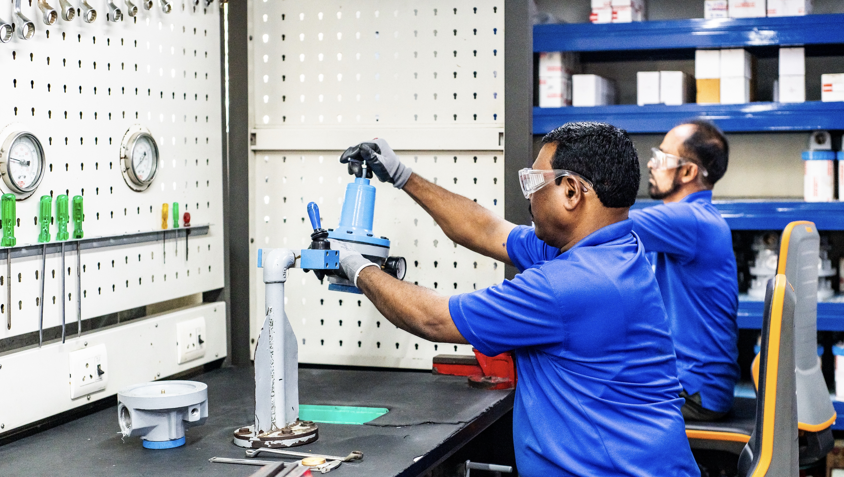 CompAir Systems engineer operating precision machinery