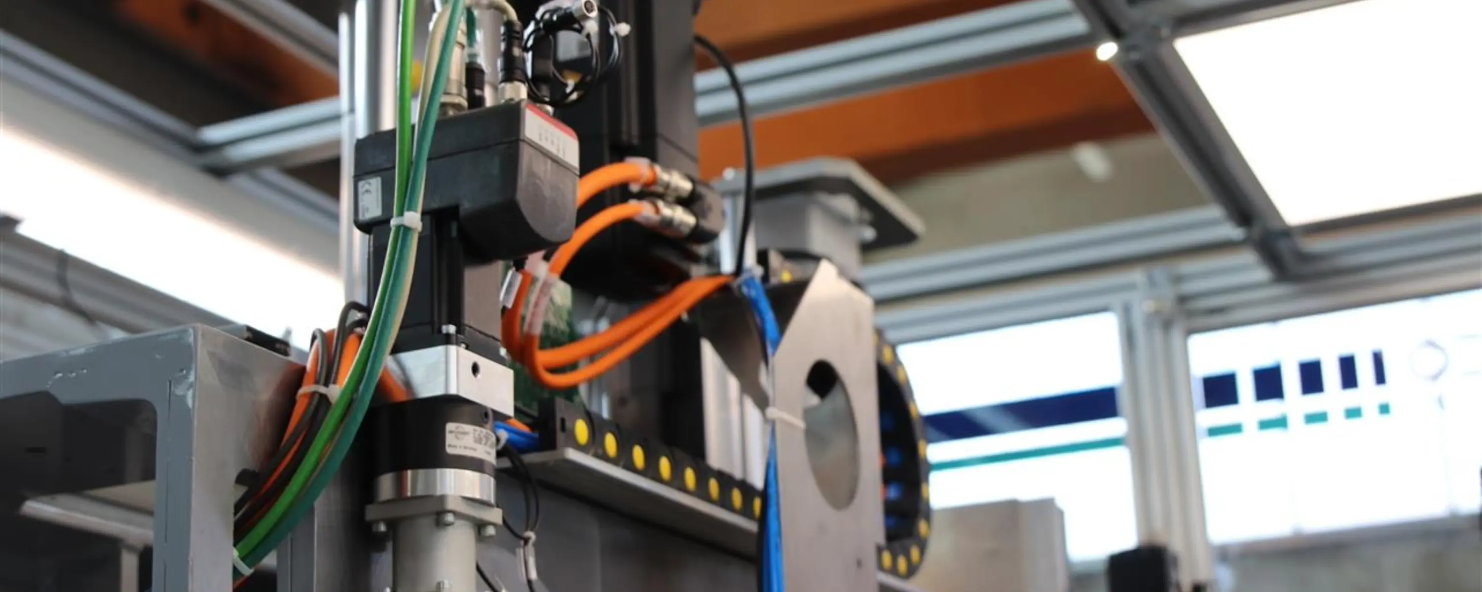 Camozzi Series DRVI integrated drive and electromechanical axis installed on an automated Indeco Automation assembly line.