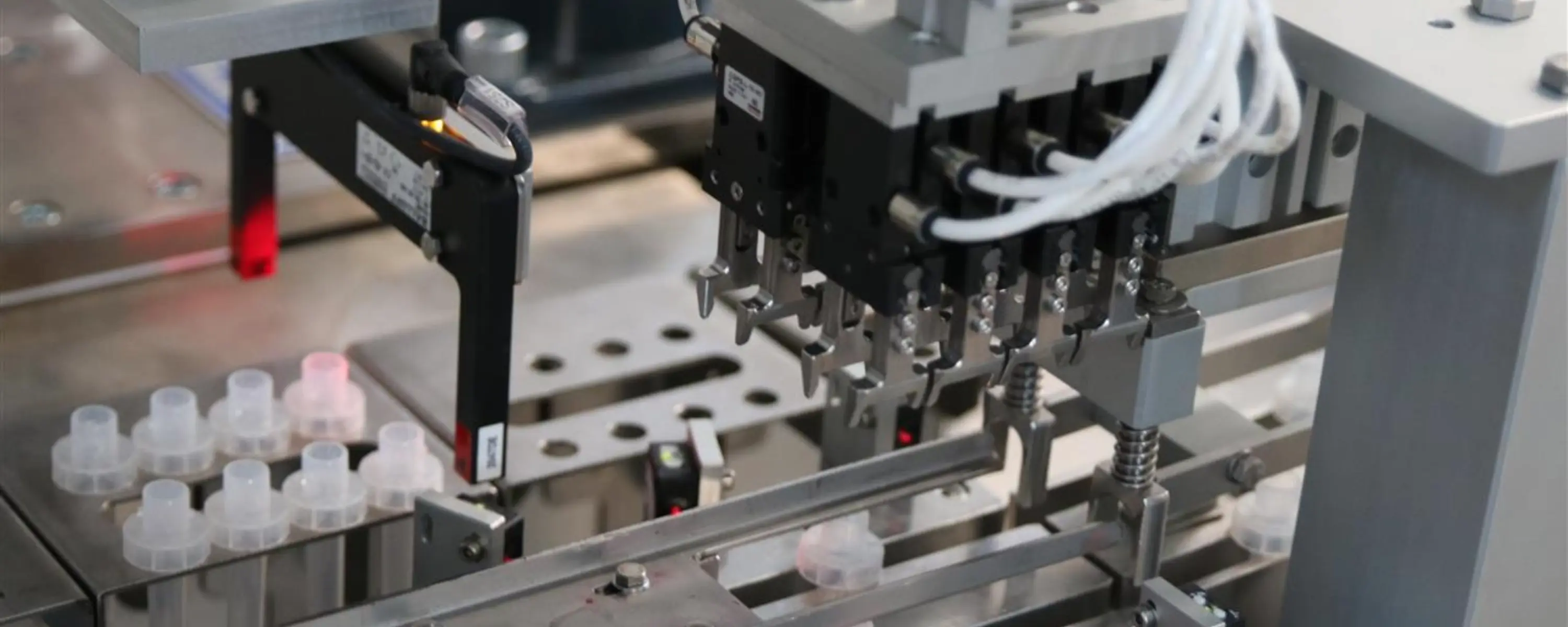 Camozzi gripper integrated into Bonetto Automation equipment for automated handling of pre filled test tubes.