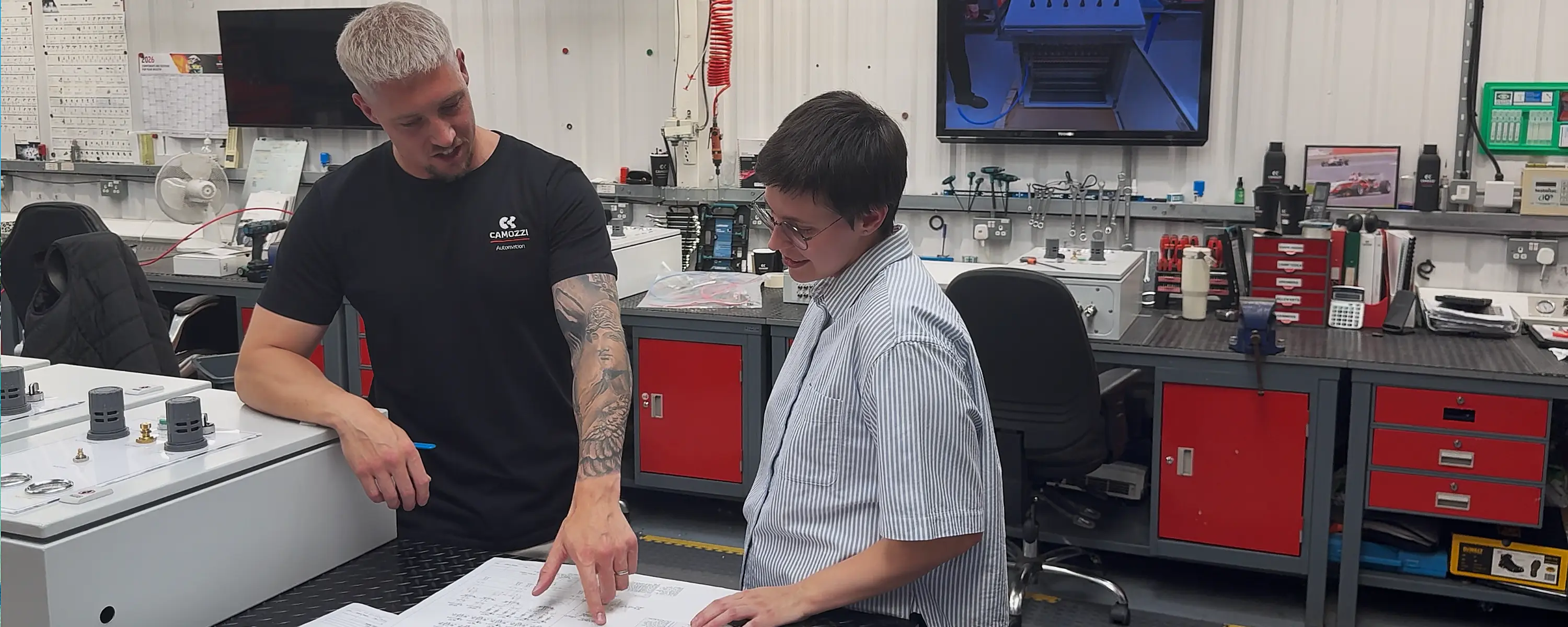 Thom Atkins and Alla Sorokina reviewing engineering drawings at the Camozzi UK Applications & Automation Centre.