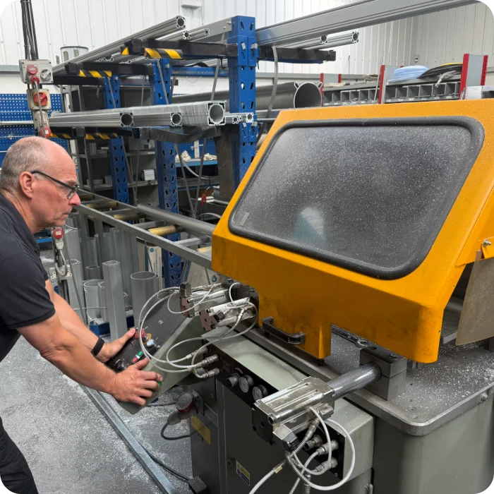 A Camozzi Automation UK engineer operating state of the art CNC equipment to precision machine a piston rod for a custom pneumatic cylinder.