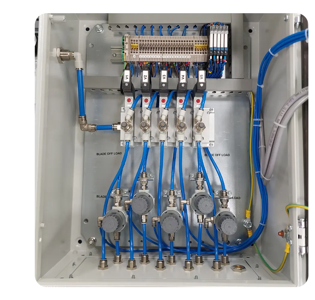 Internal panel backplate featuring a row of five solenoid valves (V1-V5) routing blue pneumatic tubing down to five individual pressure regulators, demonstrating precise airflow control.