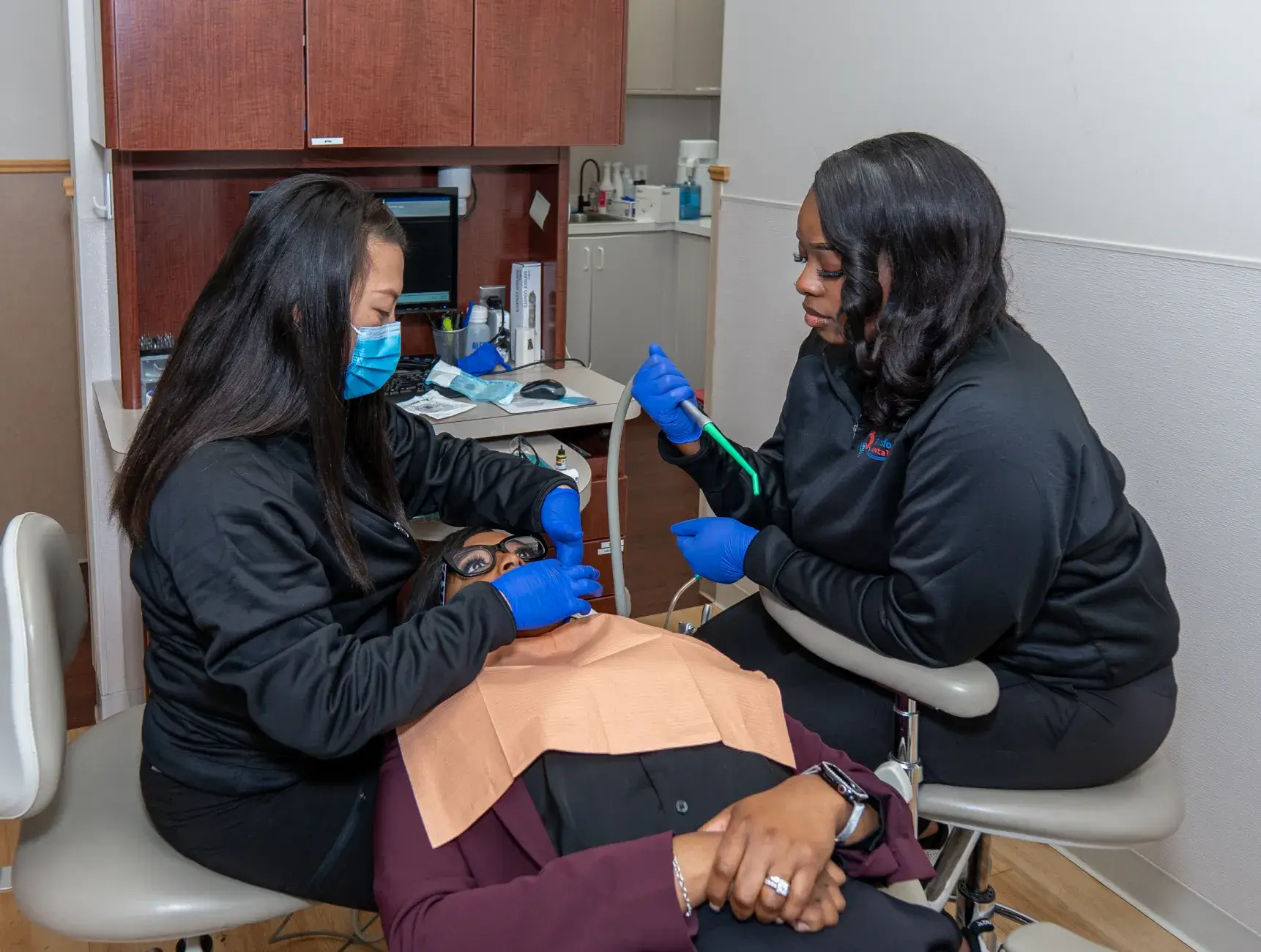 Dr. Phung and team member checking patient