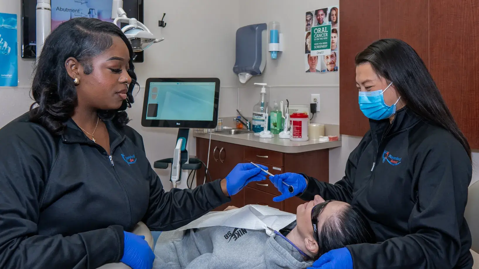 Dr. Phung and team member checking patient