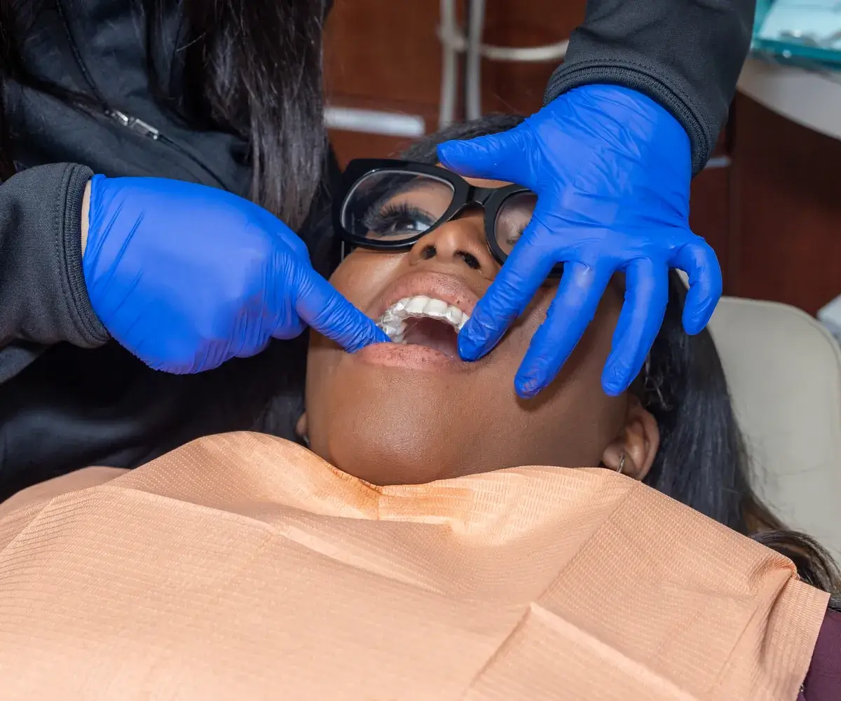 Patient getting her teeth checked