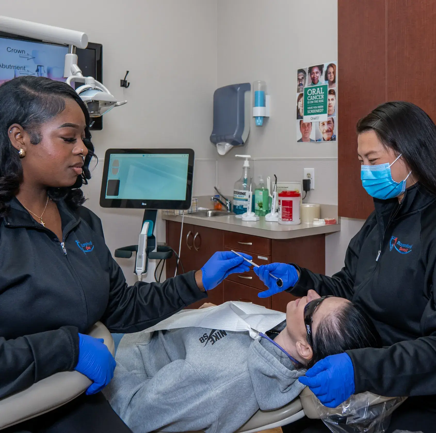 Dr. Phung and team member checking patient
